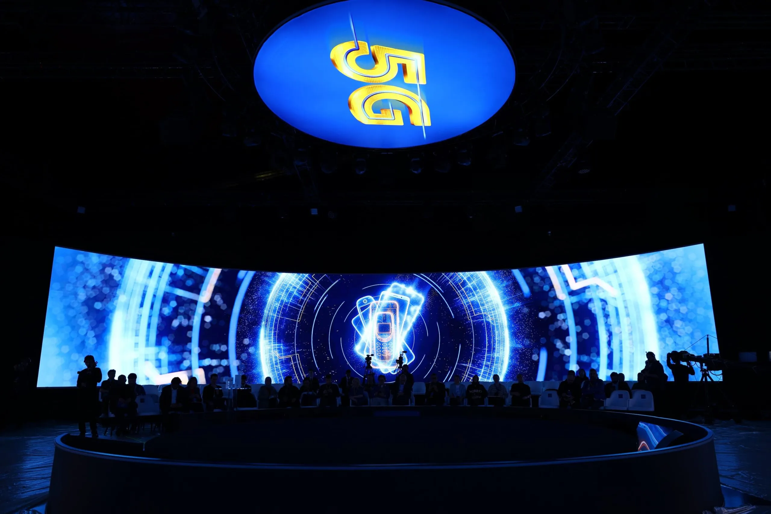 The LED ring alive with a network animation above the darkened room